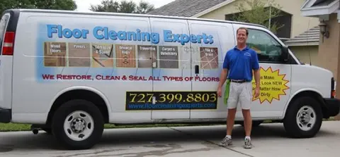 Tom of Floor Cleaning Experts with the company van